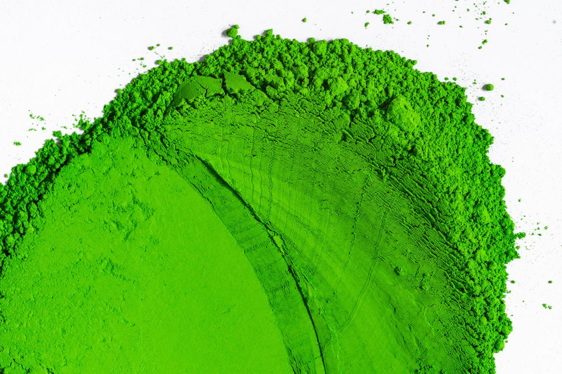 Close-up of vibrant green ceremonial grade matcha powder showing quality and colour